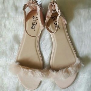 Strappy faux fur flats.